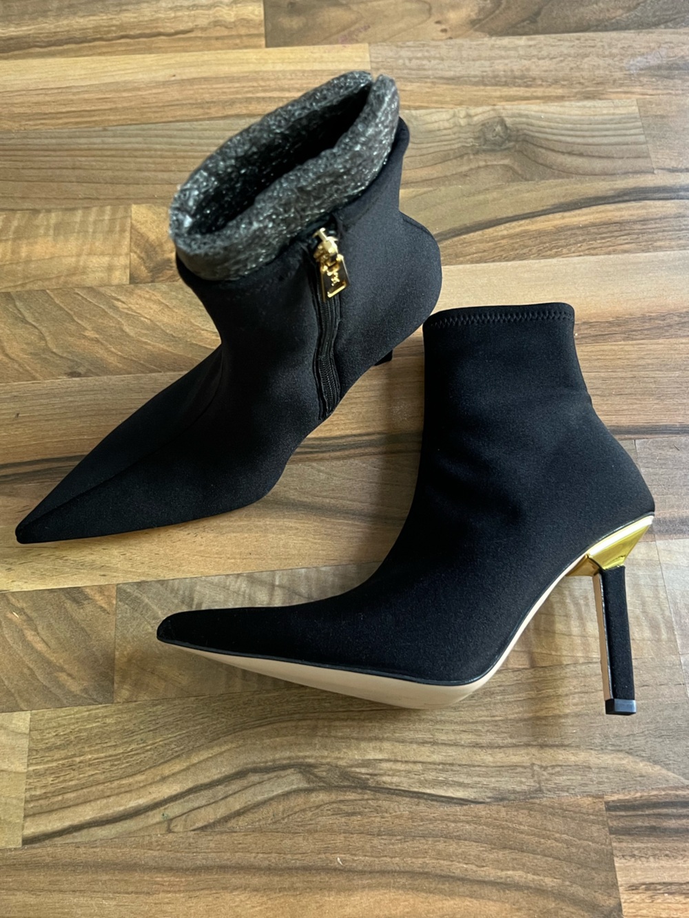 Good American Black Stretch Sock Booties with Gold Heel Accent